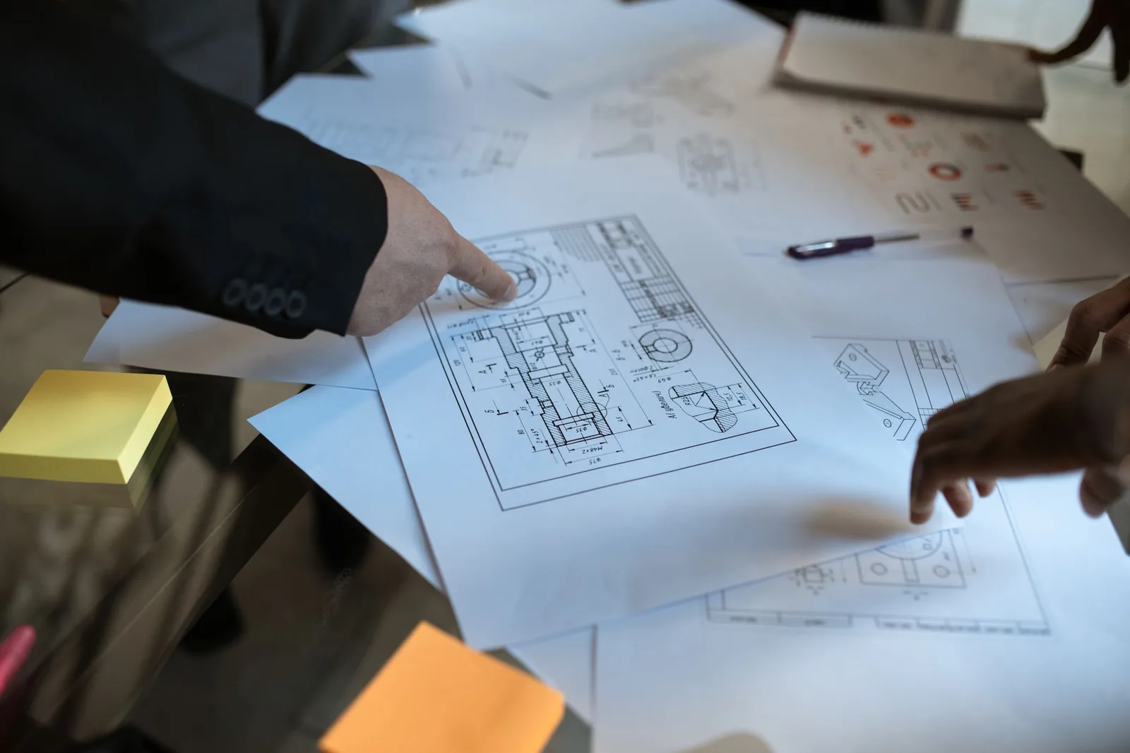 Drop image — Architect at drafting table