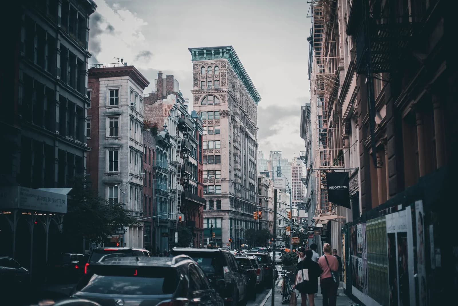 Urban scene capturing traffic and pedestrians in historic Soho, NYC.