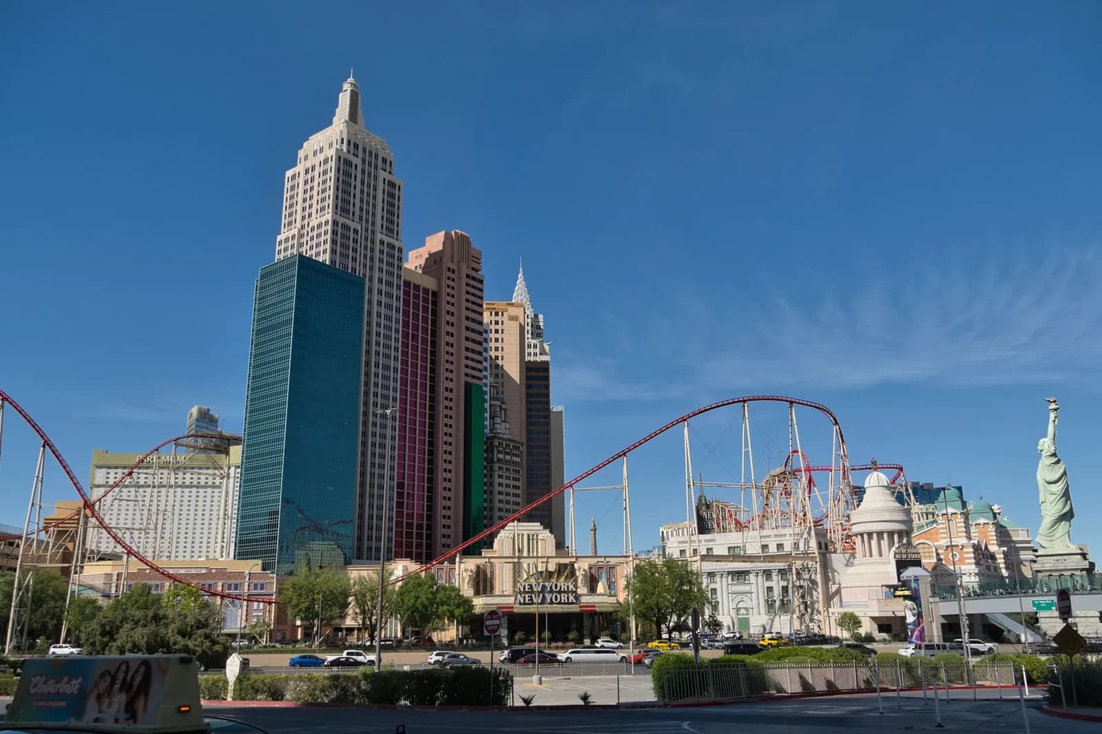 View of New York-New York Hotel and Casino with roller coaster and replica Statue of Liberty in Las Vegas.
