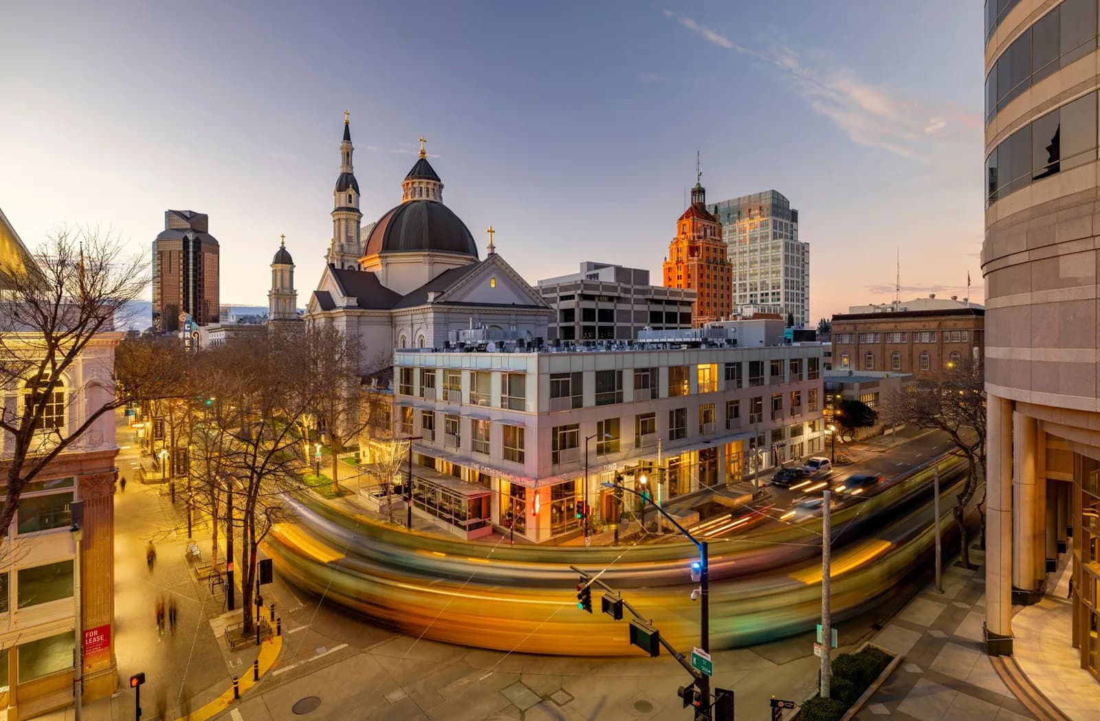 Stunning aerial shot capturing the vibrant cityscape of downtown Sacramento at dusk with light trails and landmarks.
