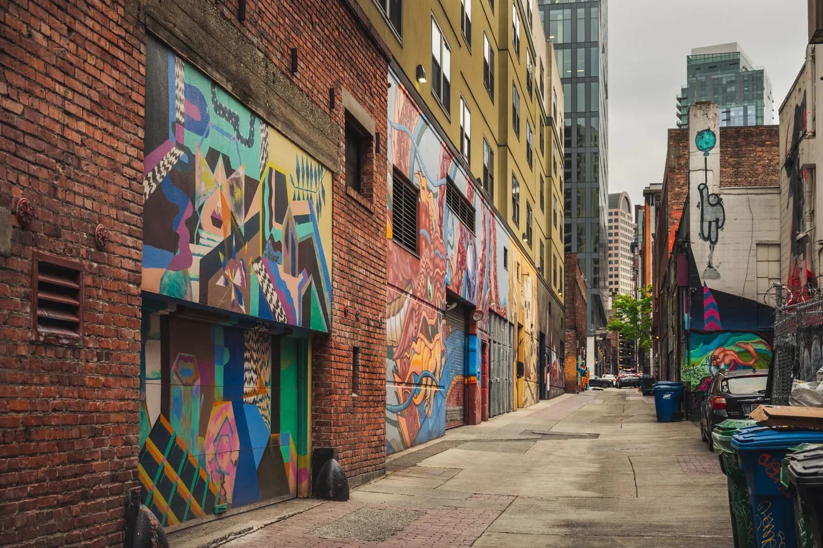 A colorful graffiti-covered alley in downtown Seattle showcasing urban street art.