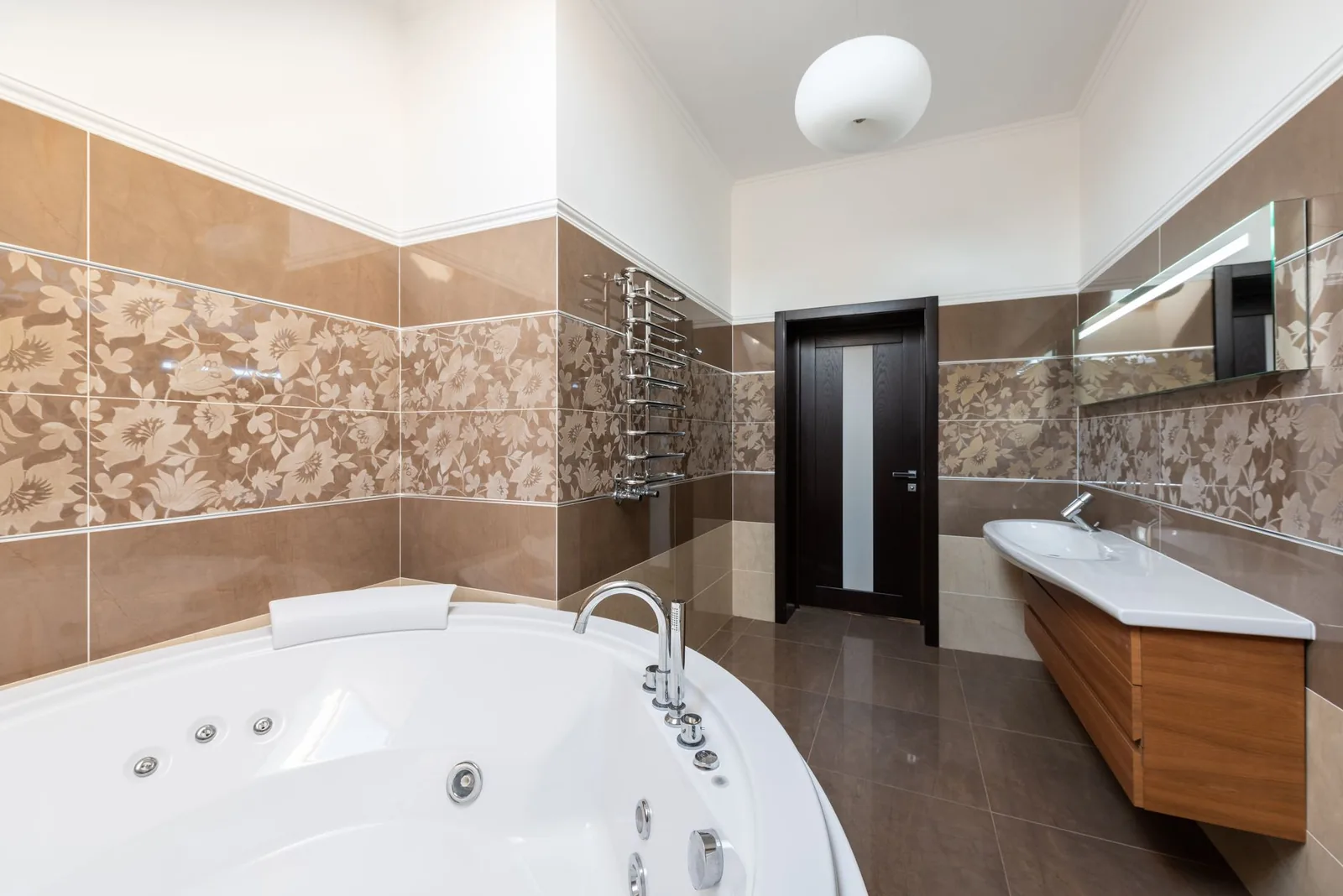 Fluted vanity in a windowed powder room