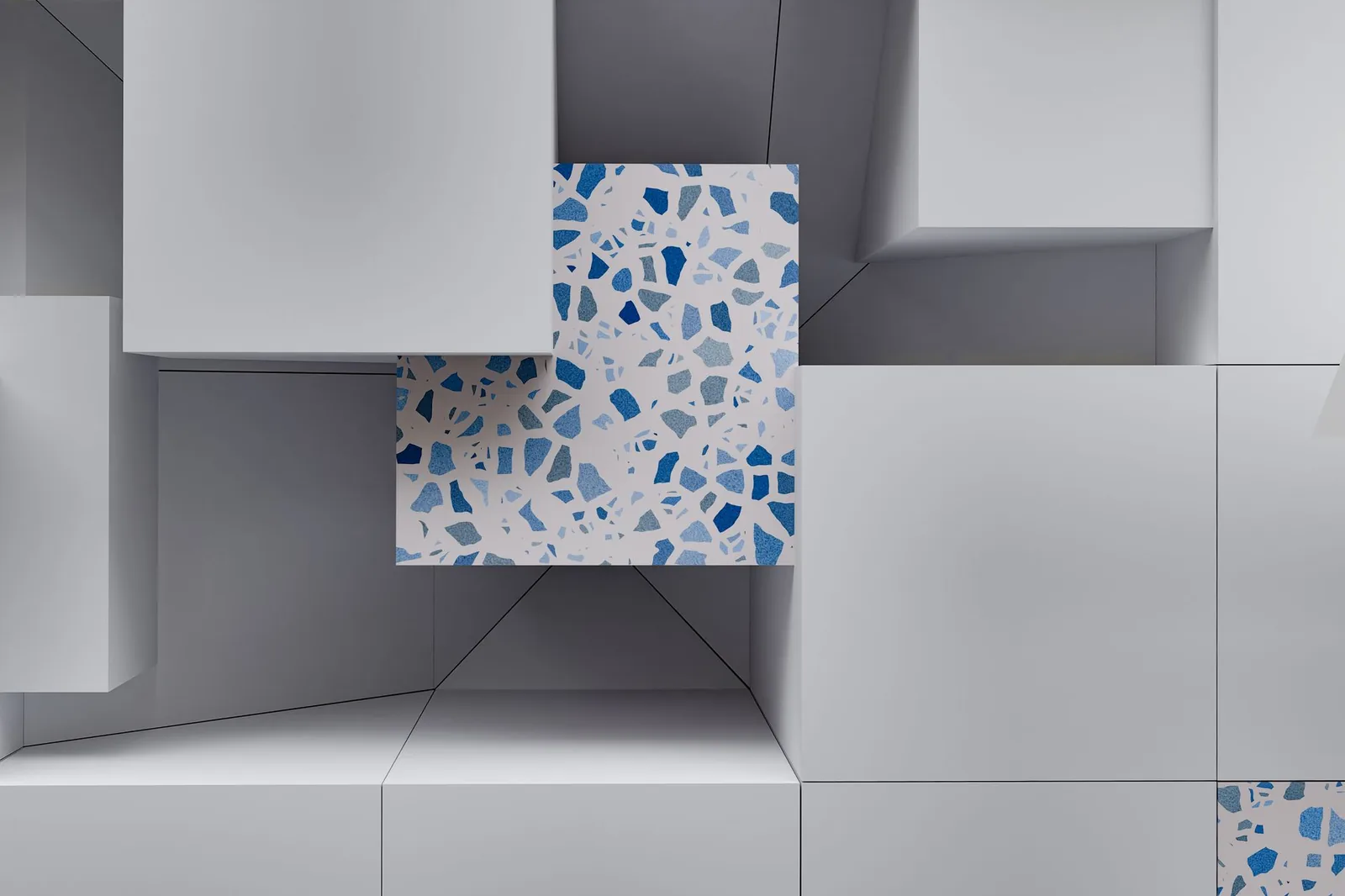 A modern abstract depiction of 3D cubes with a terrazzo pattern featuring blue accents.
